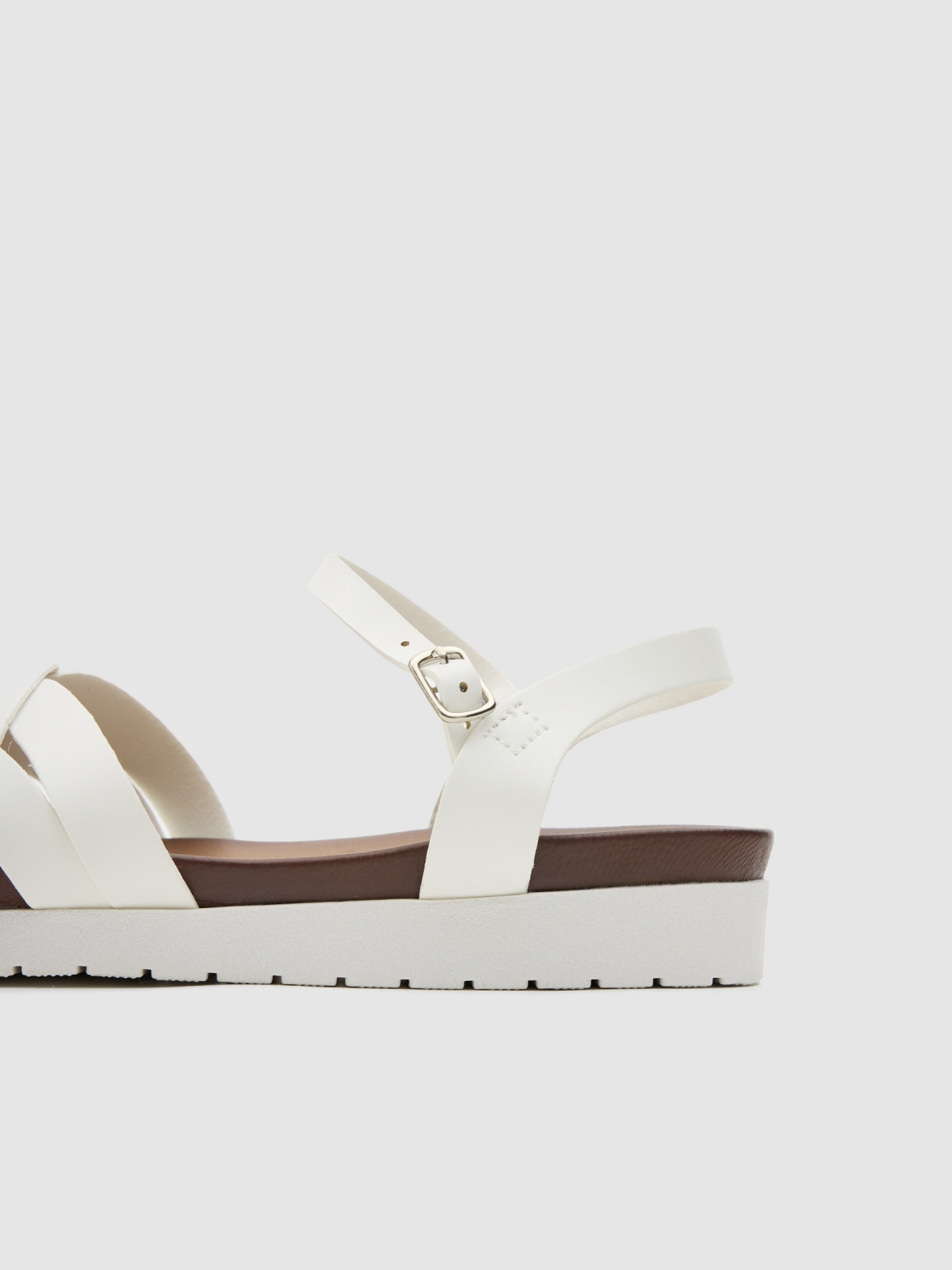 Crossed sandals white detail view