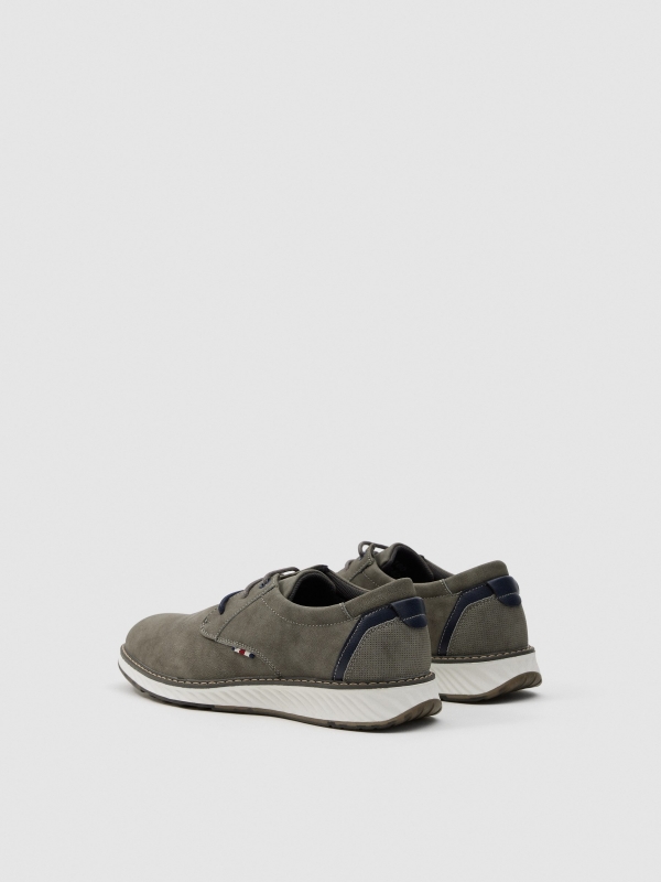 Sports shoe with laces medium grey 45º front view