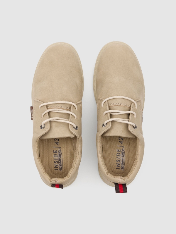 Casual lace-up sneakers sand zenithal view