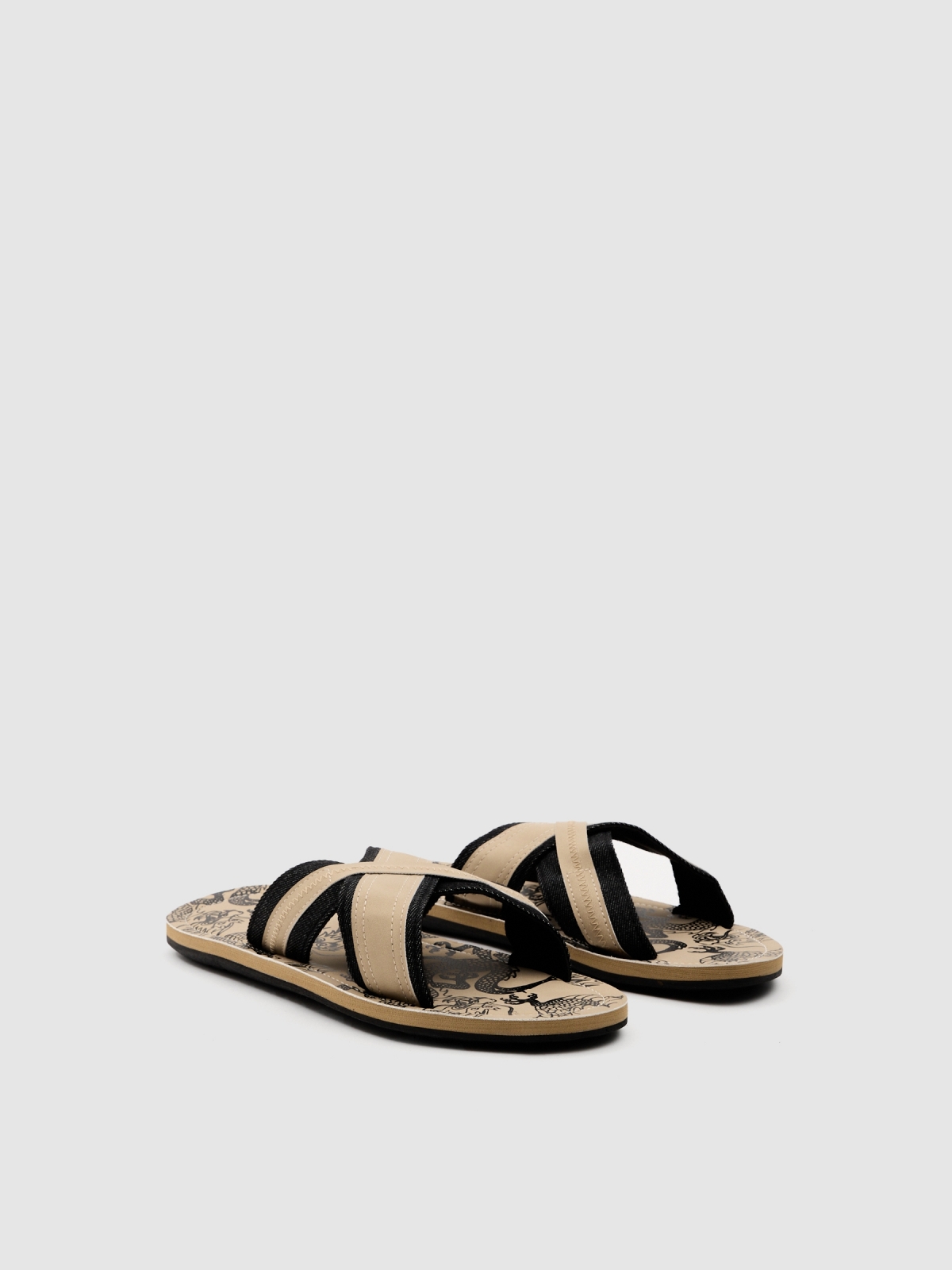 Crossed sandals sand 45º front view