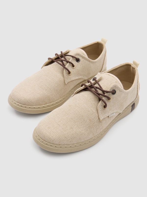 Canvas lace-up sneakers sand detail view