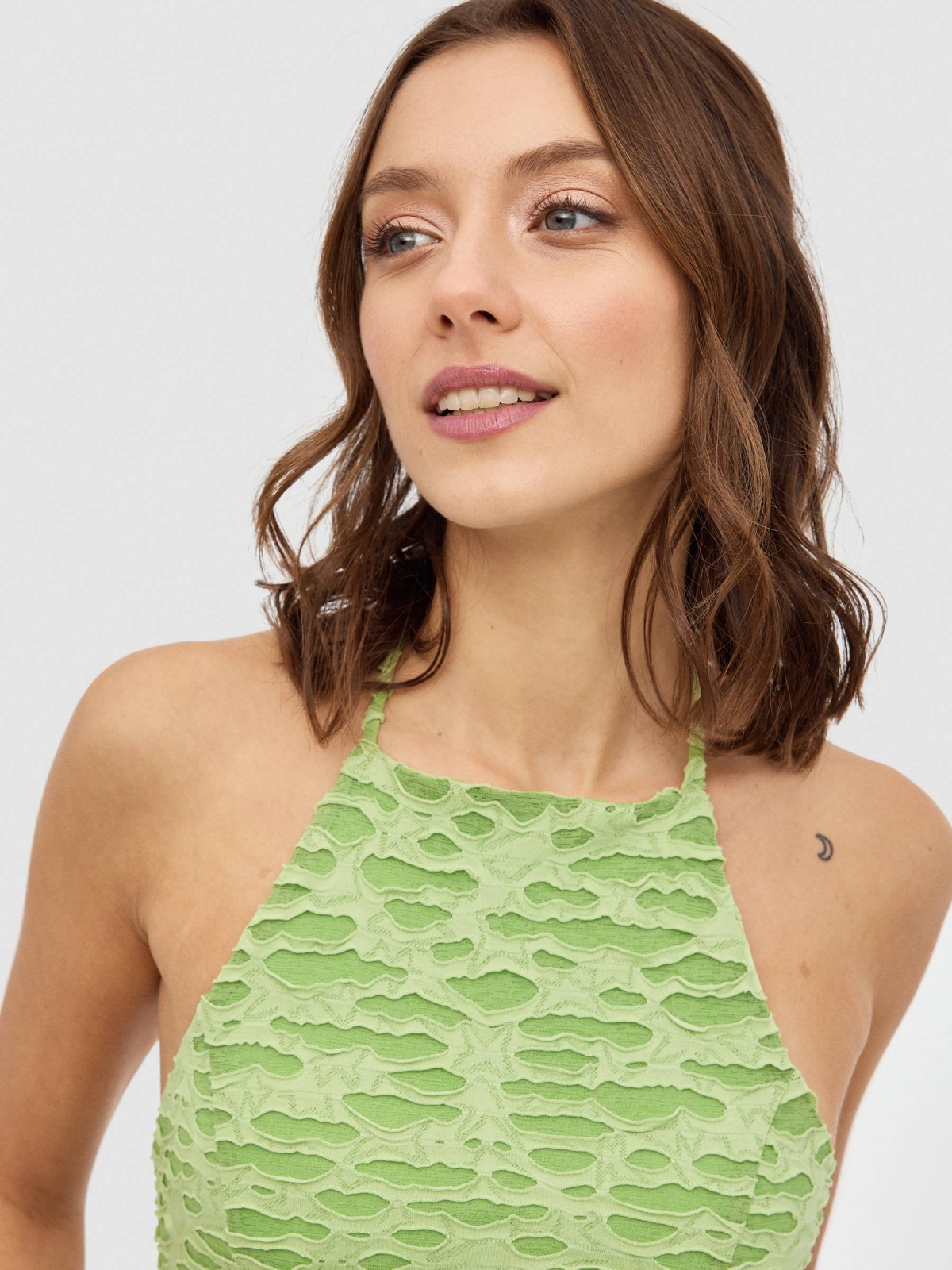 Halter top with knotted back light green detail view