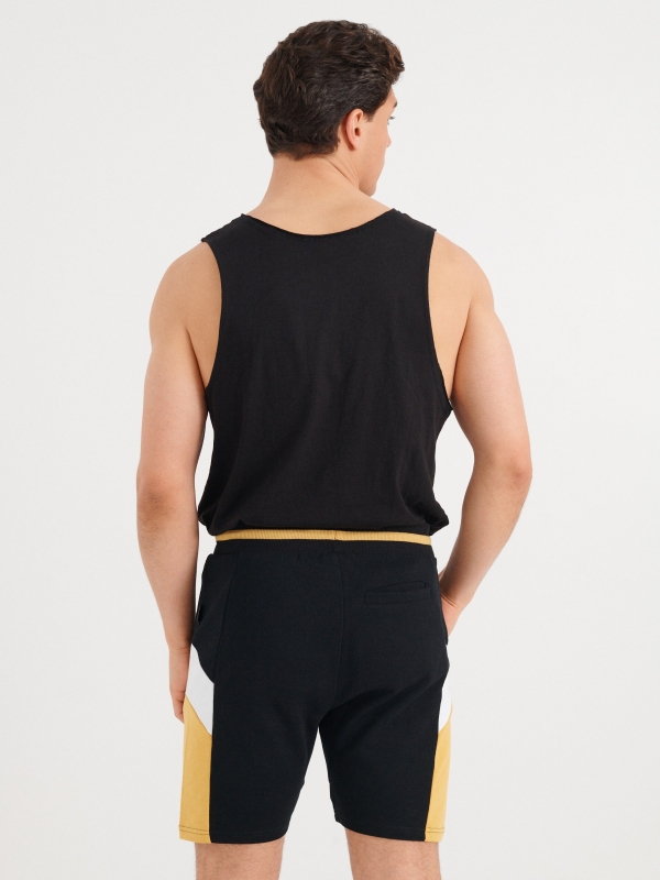 Side panels jogger  bermuda shorts black middle back view