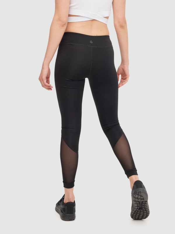 Leggings with mesh parts black middle back view
