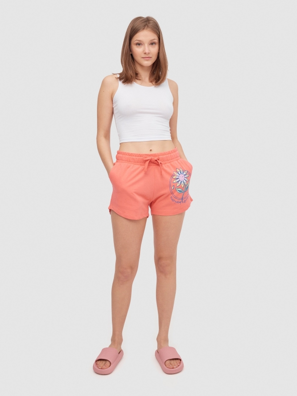 Knitted shorts with flower coral front view