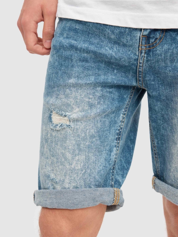 Denim shorts frayed blue detail view