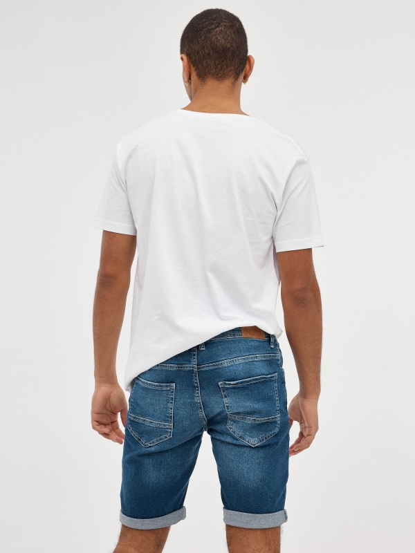 Ripped distressed denim bermuda short blue middle back view
