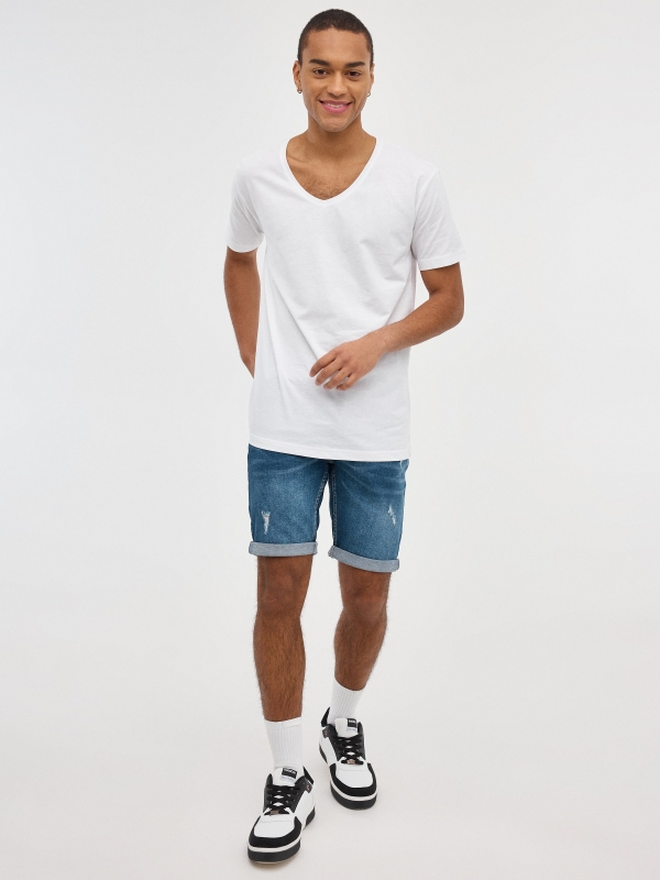 Ripped distressed denim bermuda short blue front view