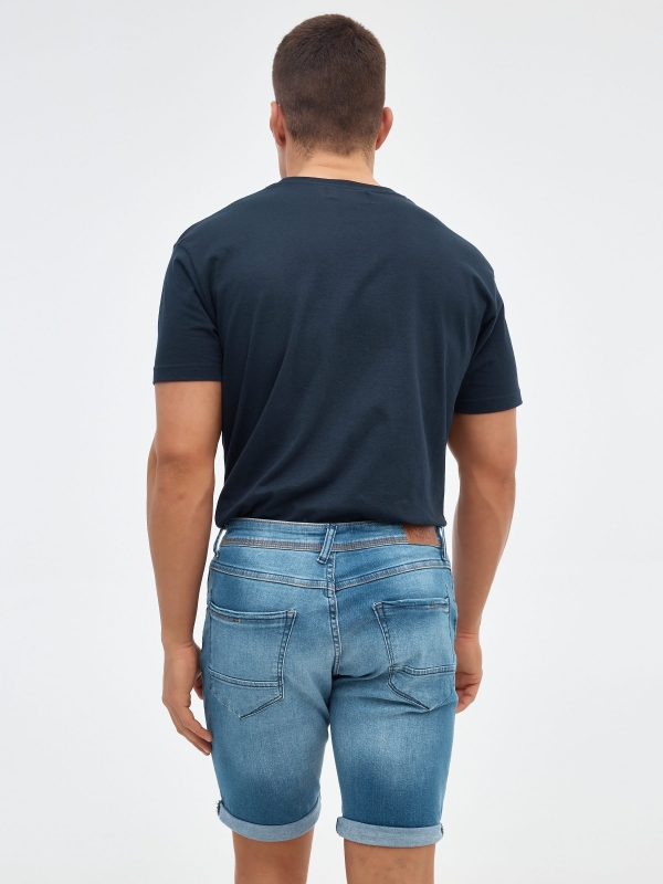 Ripped distressed denim bermuda short blue middle back view