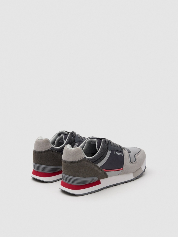 Sneaker with tricolor sole 45º back view