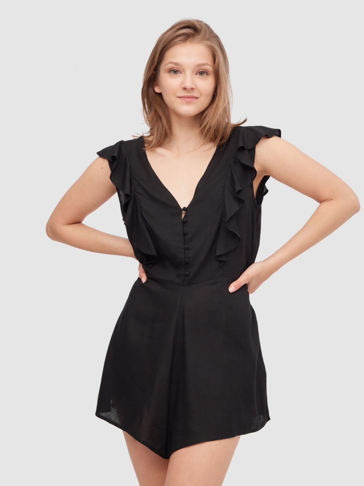Short jumpsuit with buttons black front view