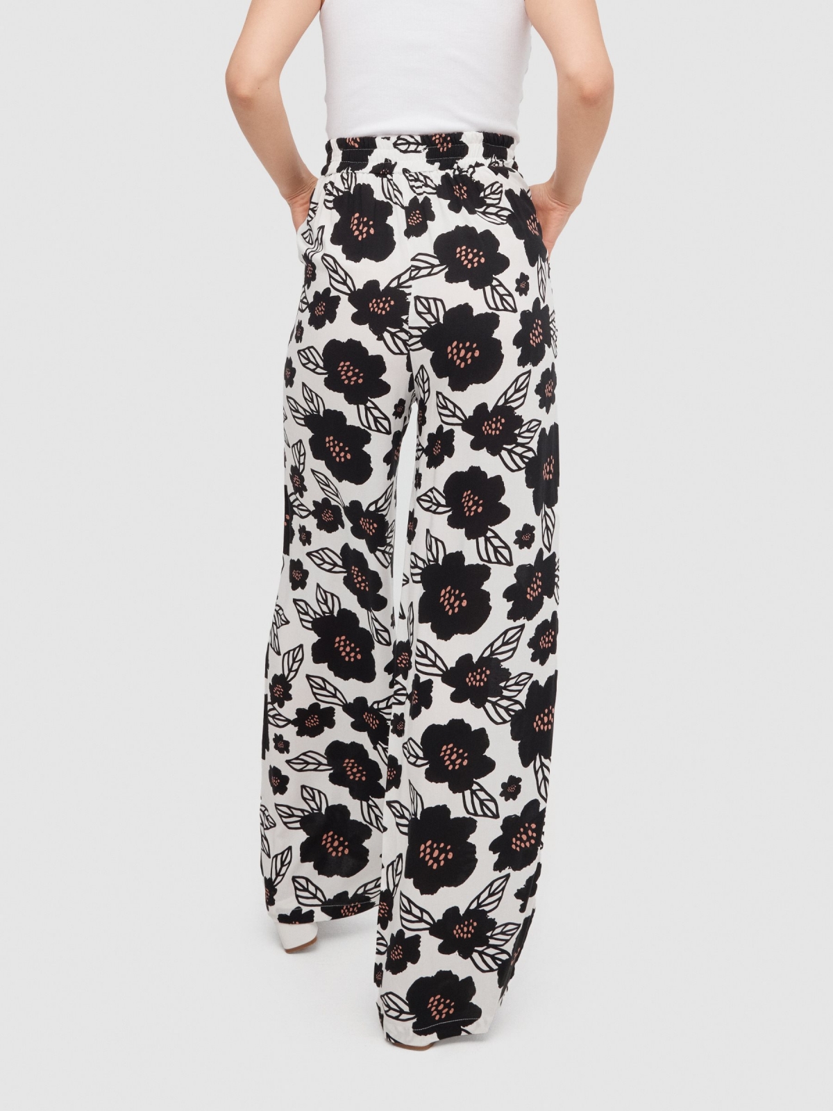 Flowy floral print pants white middle back view