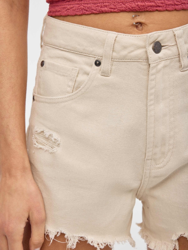 Flared shorts sand detail view