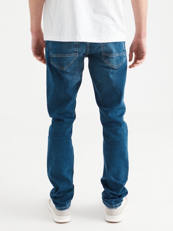 Jeans slim azul lavado rotos azul vista media trasera