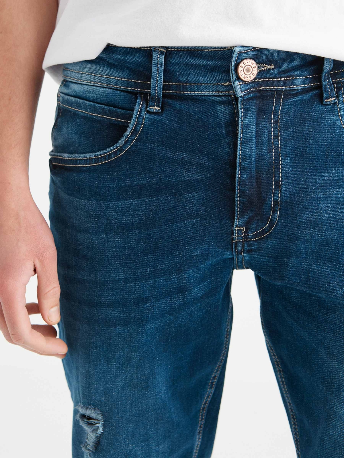 Ripped washed blue slim jeans blue detail view