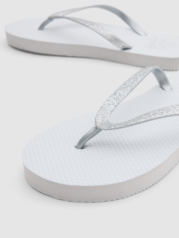White toe flip flop with glitter white detail view