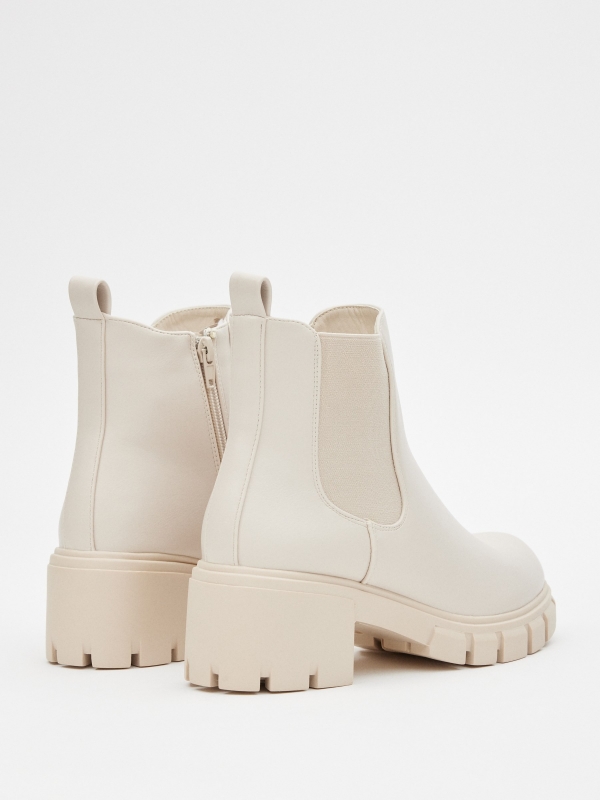 Patent leather ankle boots with elastics beige 45º back view