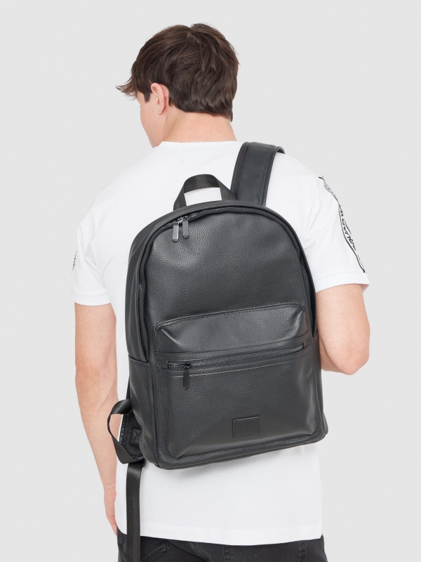 Basic black backpack black with a model