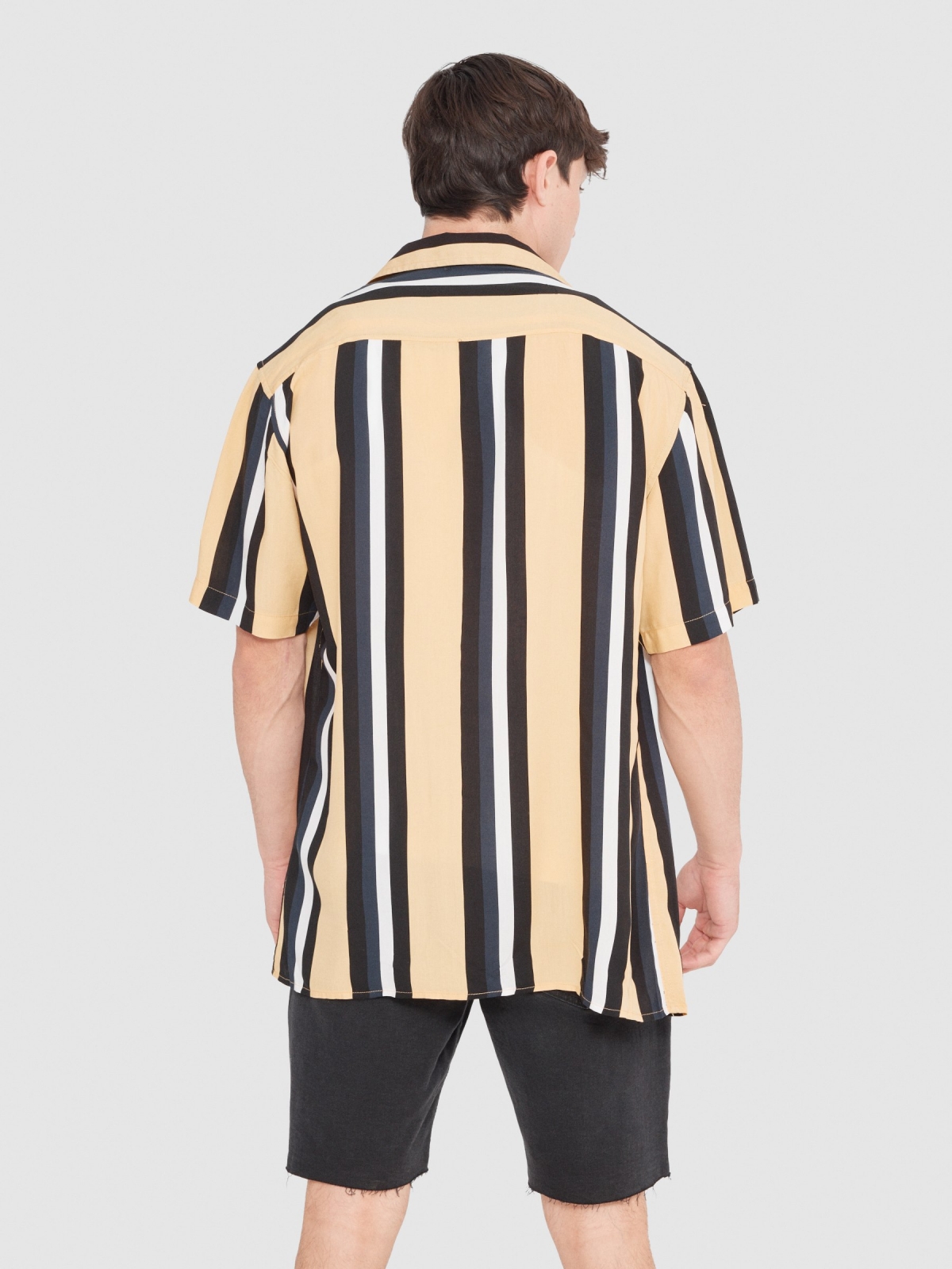 Striped shirt yellow middle back view