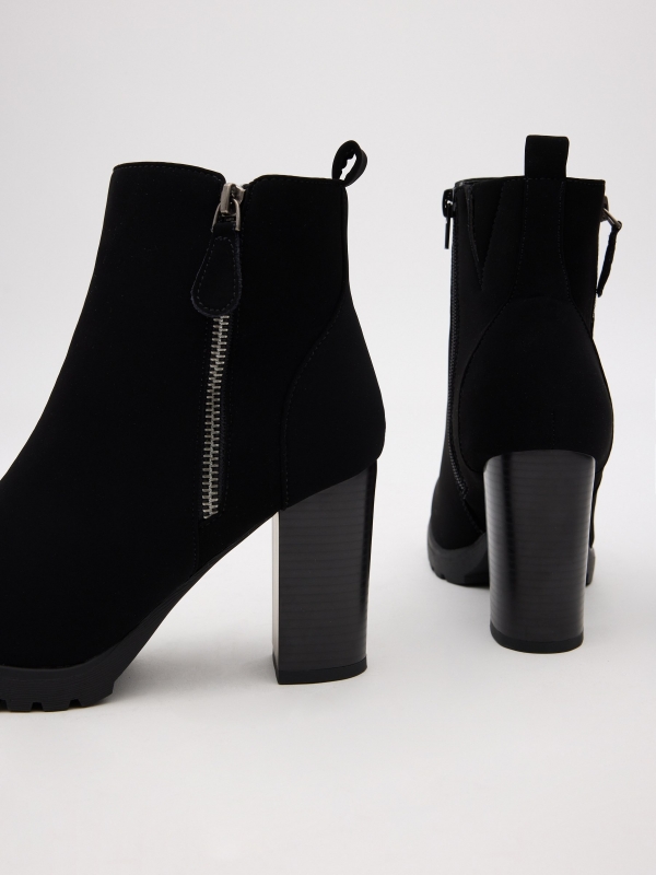 Modern heeled ankle boots black detail view