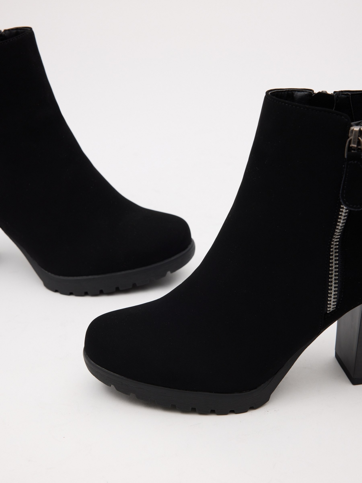 Modern heeled ankle boots black detail view