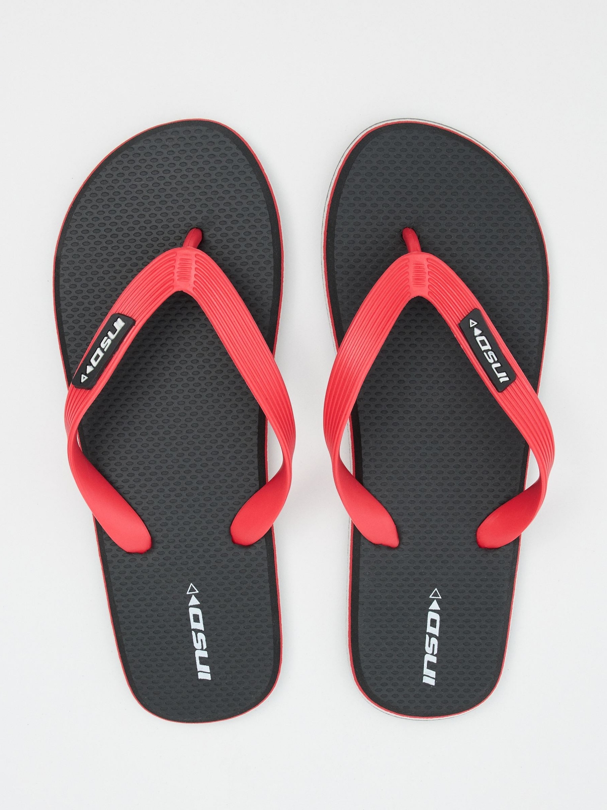 Flip flop with embossed strips