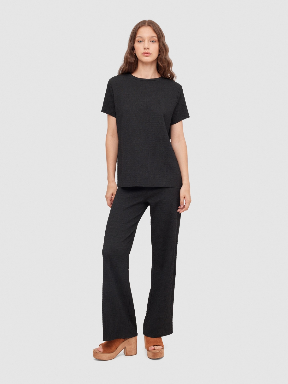 Textured fluid trousers black front view