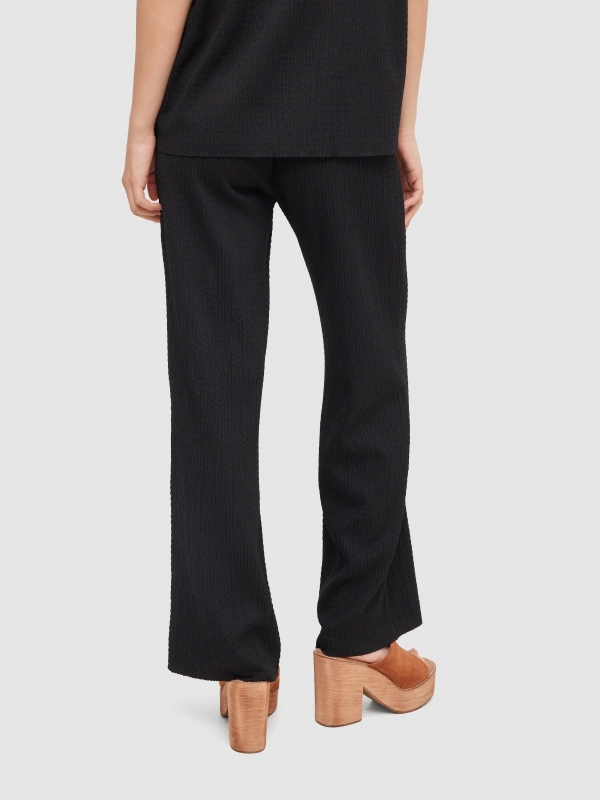 Textured fluid trousers black middle back view
