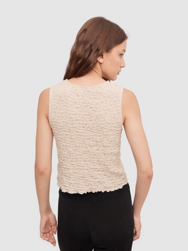 Top textured ruffled sand middle back view