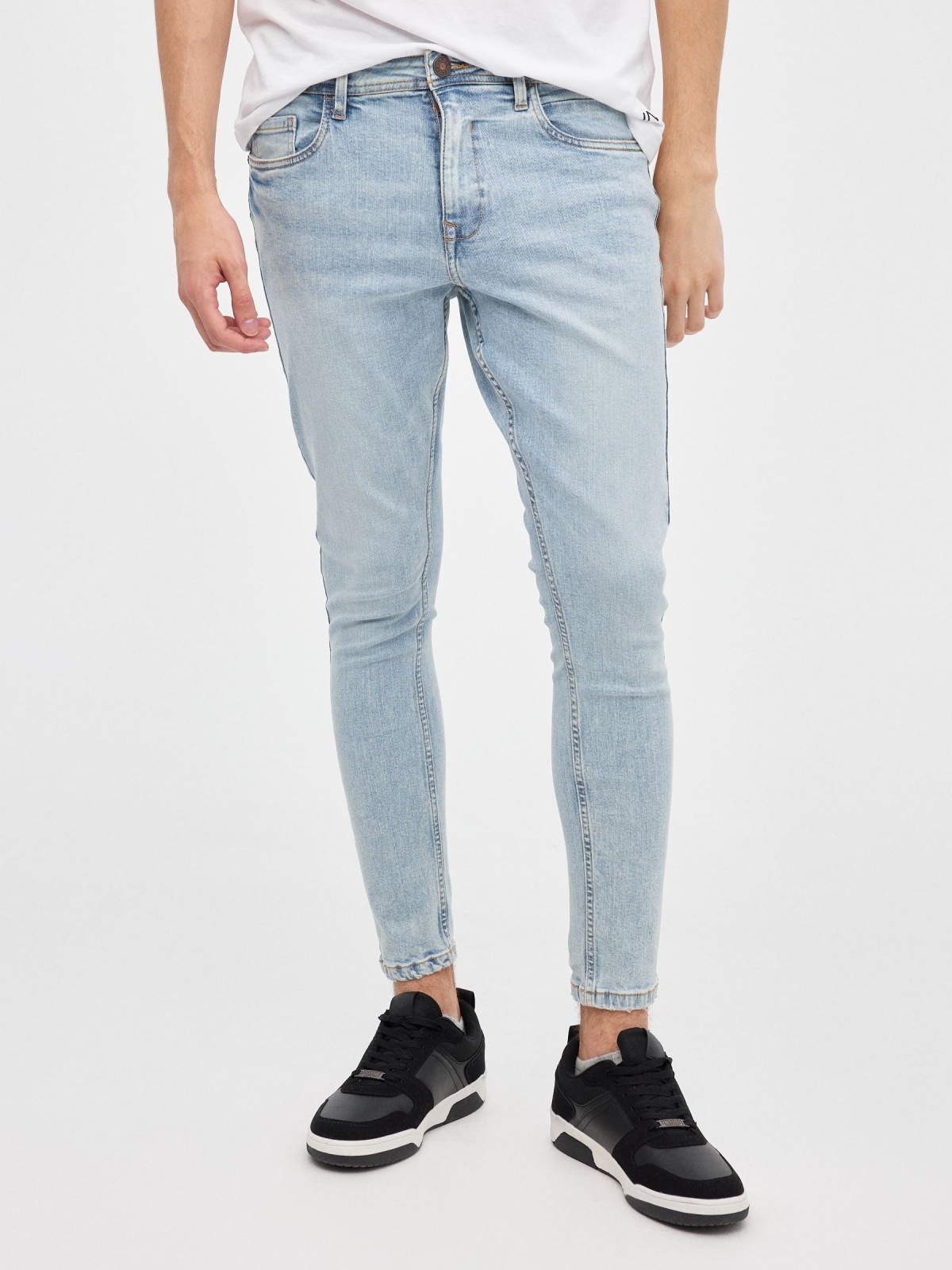 Light denim skinny jeans blue middle front view