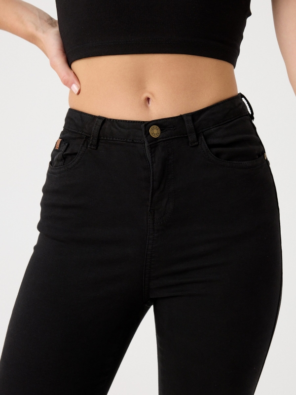 High rise skinny pants black detail view