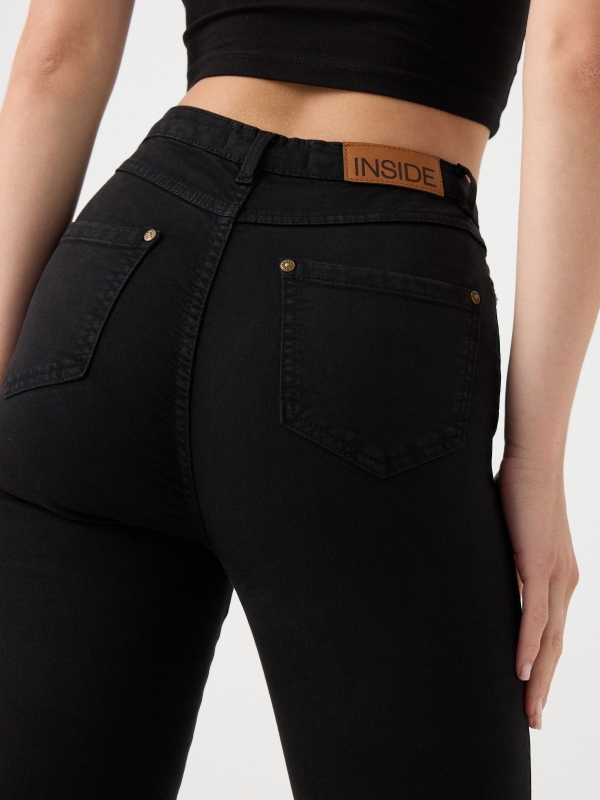 High rise skinny pants black detail view