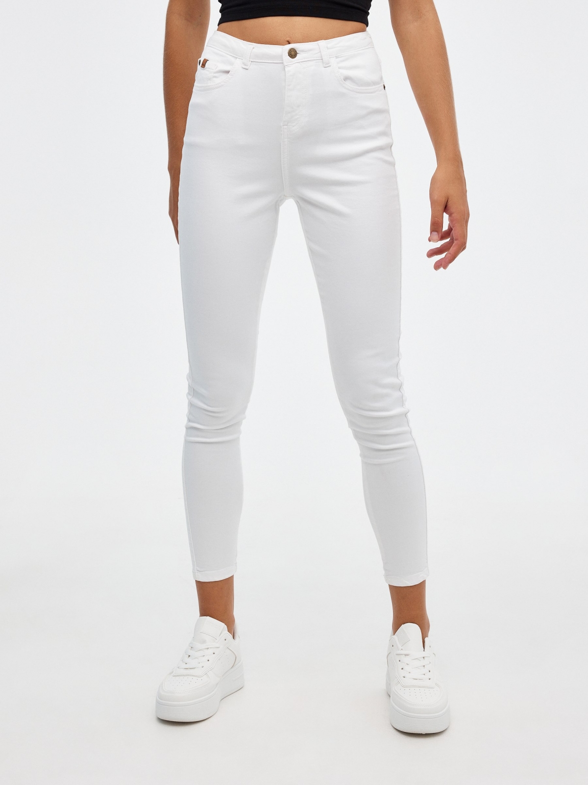 High rise skinny pants white middle front view