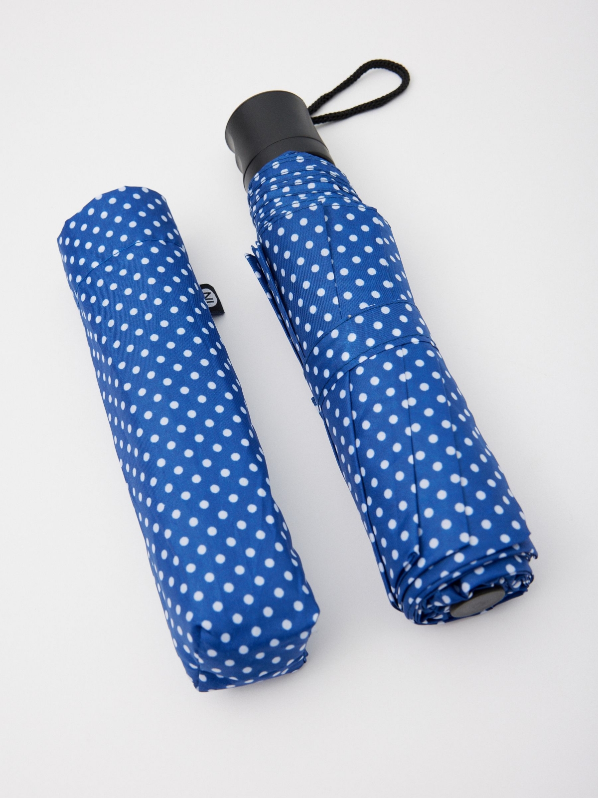 Polka dot folding umbrella blue aerial view