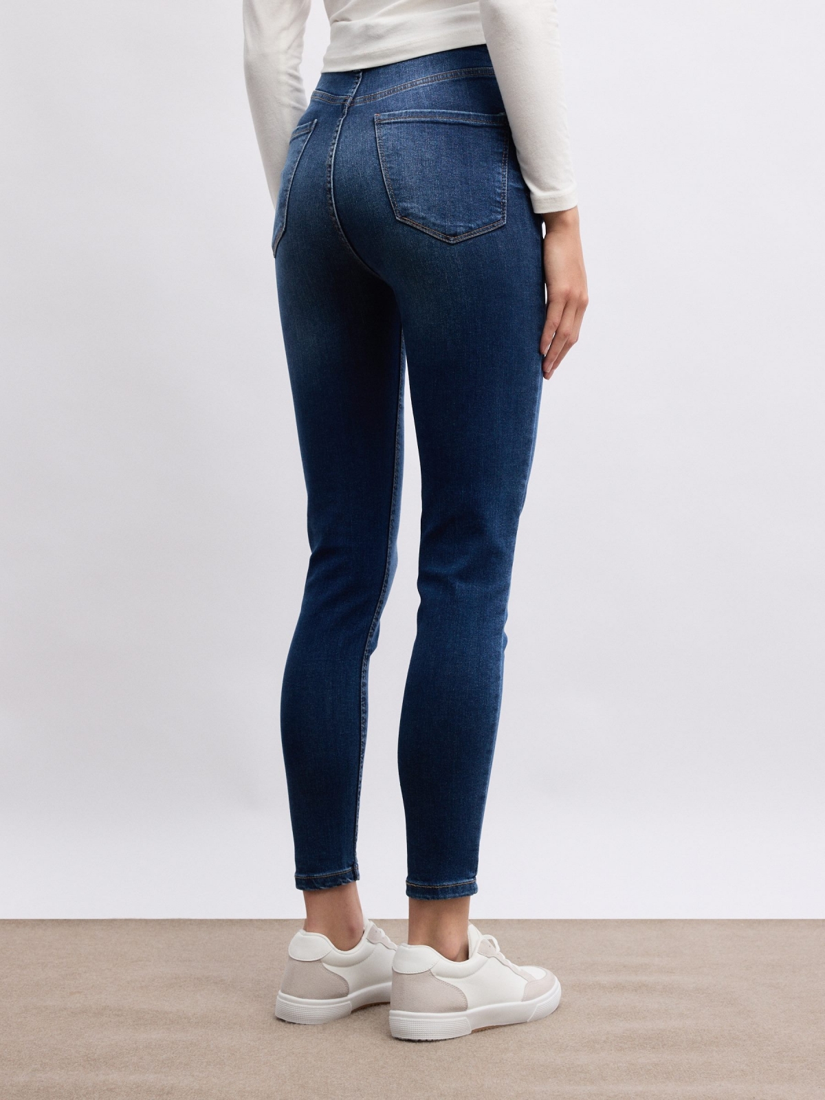 Blue high waisted five pocket skinny jeans blue middle back view