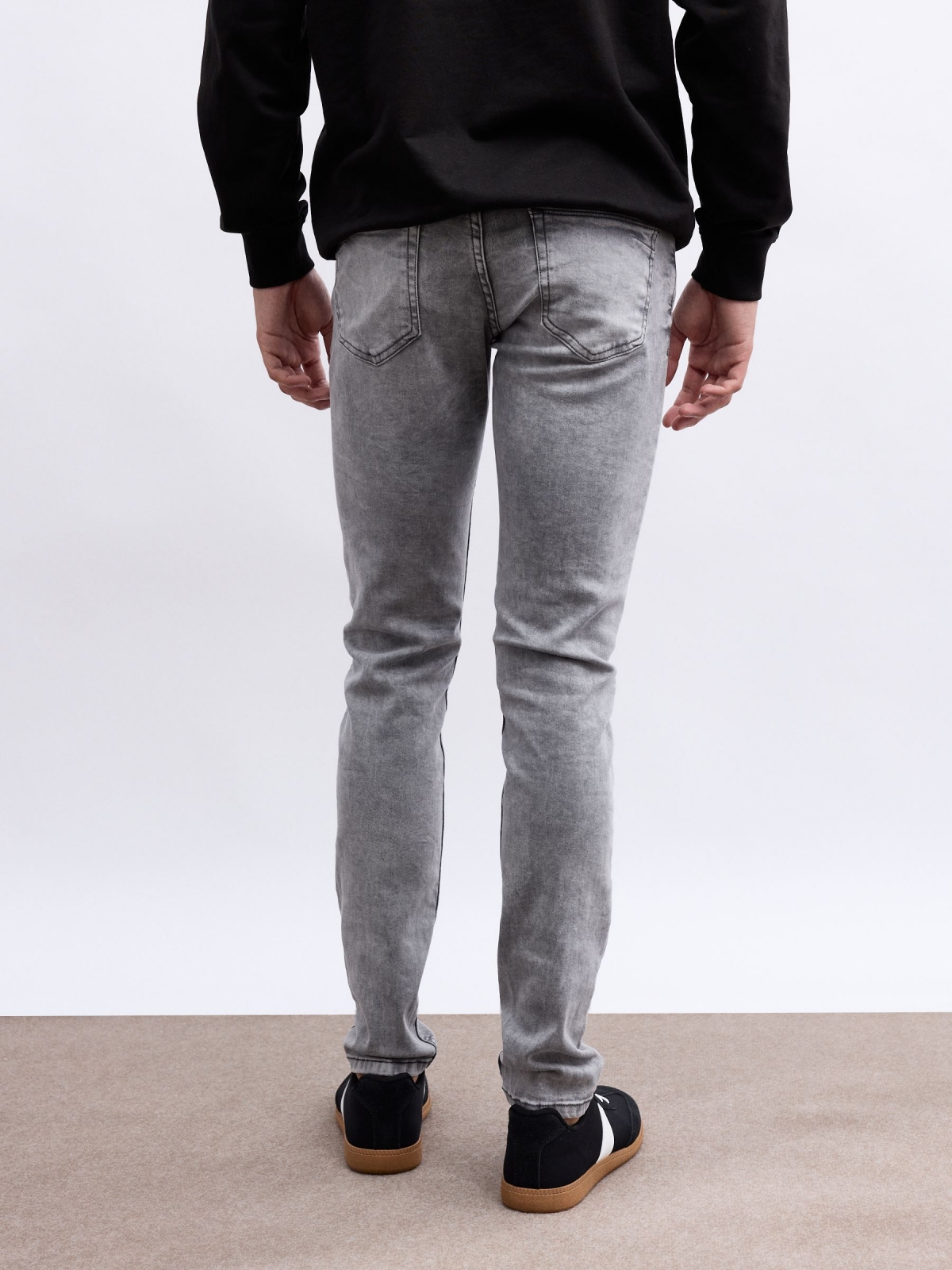 Grey super slim jeans grey middle back view