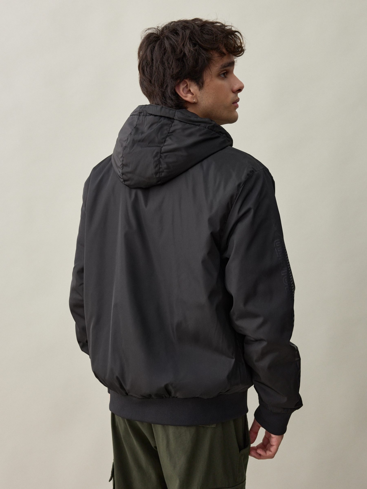 Nylon jacket with hood black middle back view