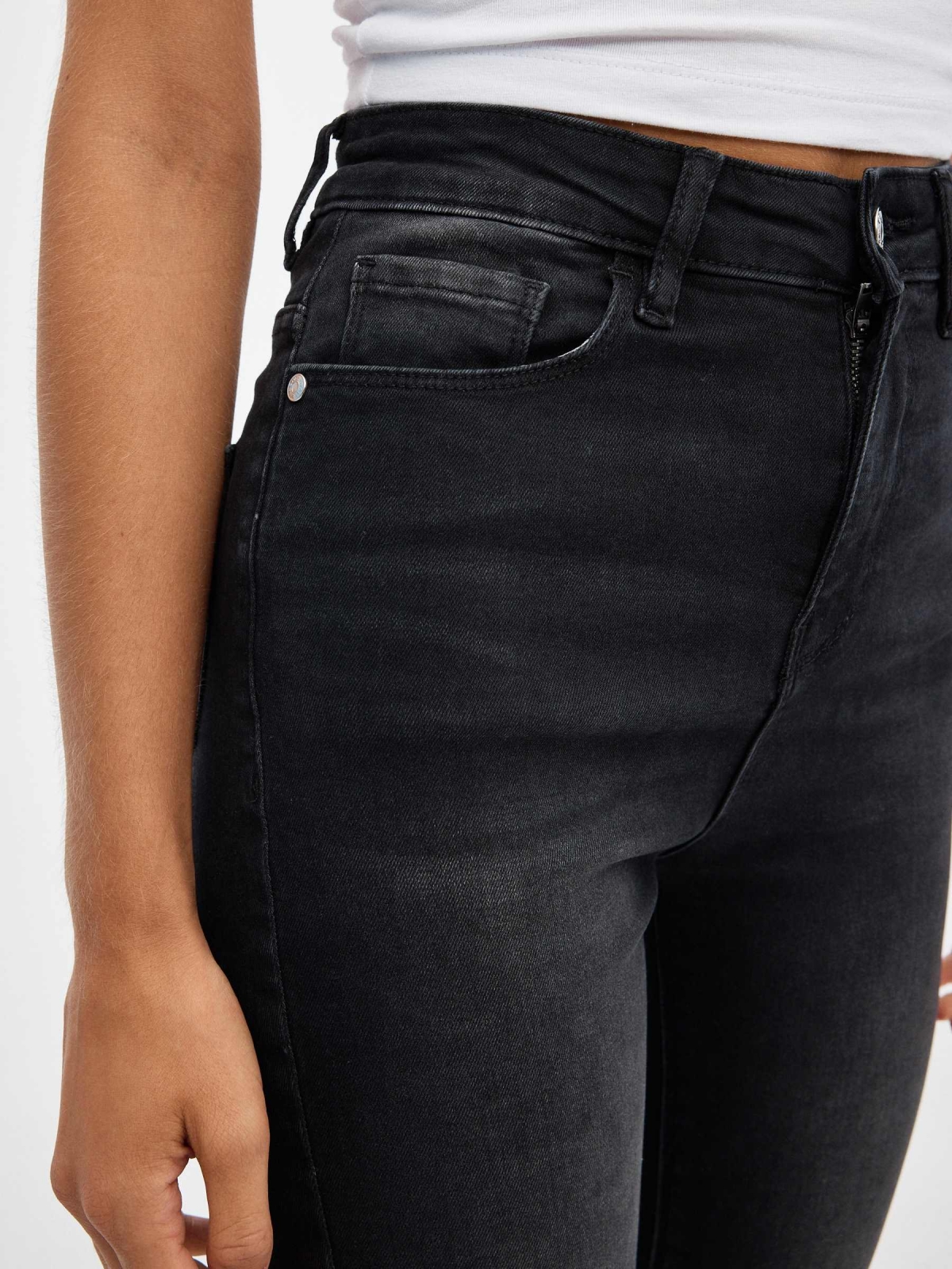 Black high rise skinny jeans black detail view