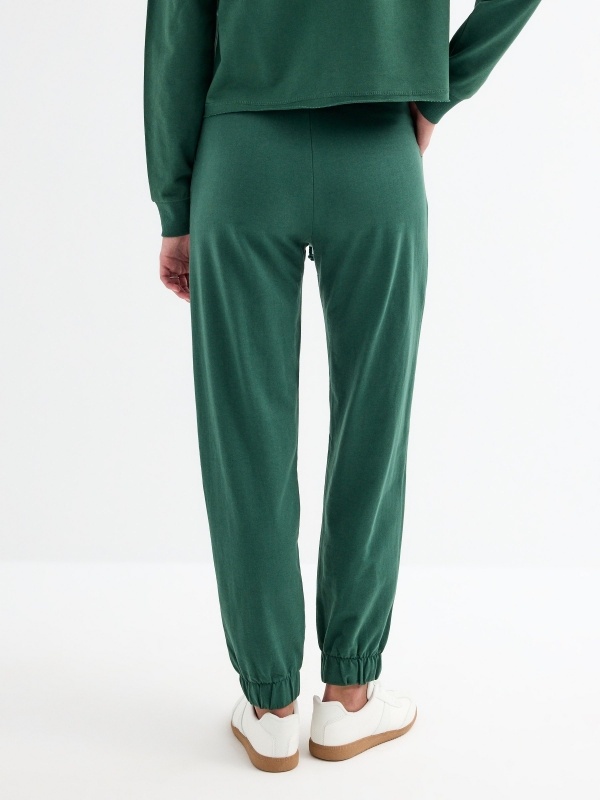 Jogger pants dark green middle back view