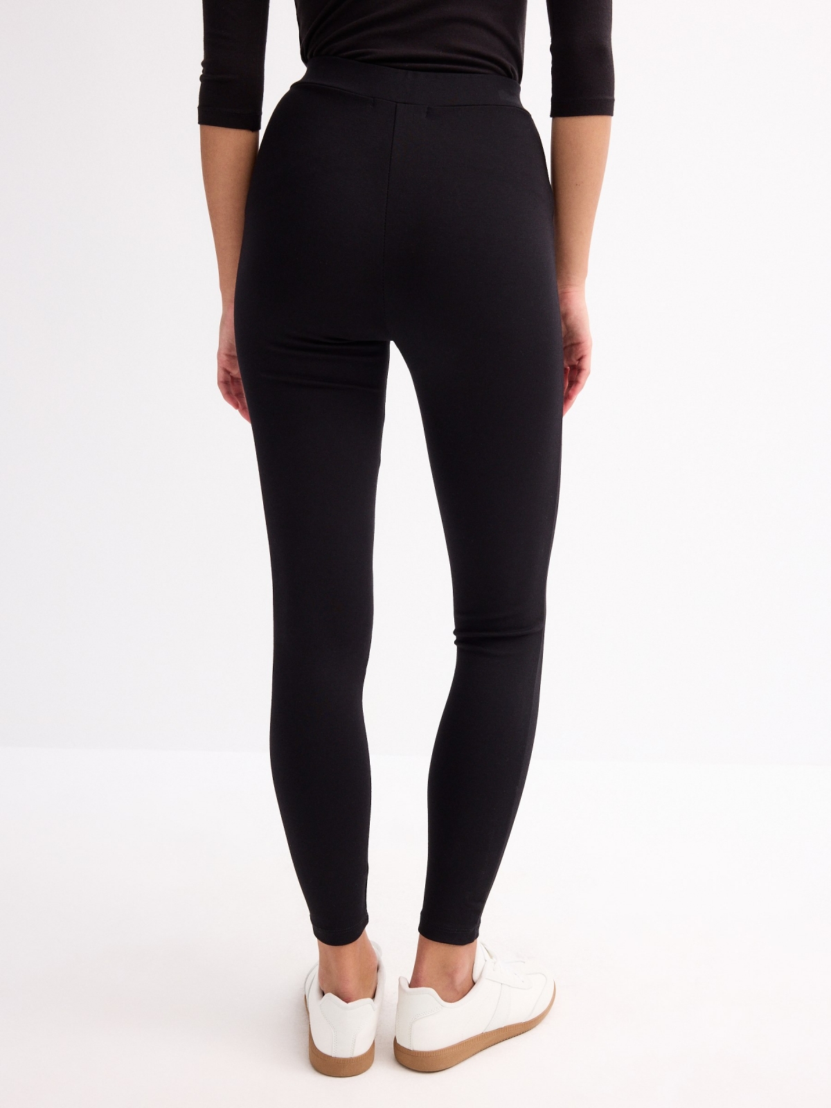 High-waisted zip-up leggings black middle back view