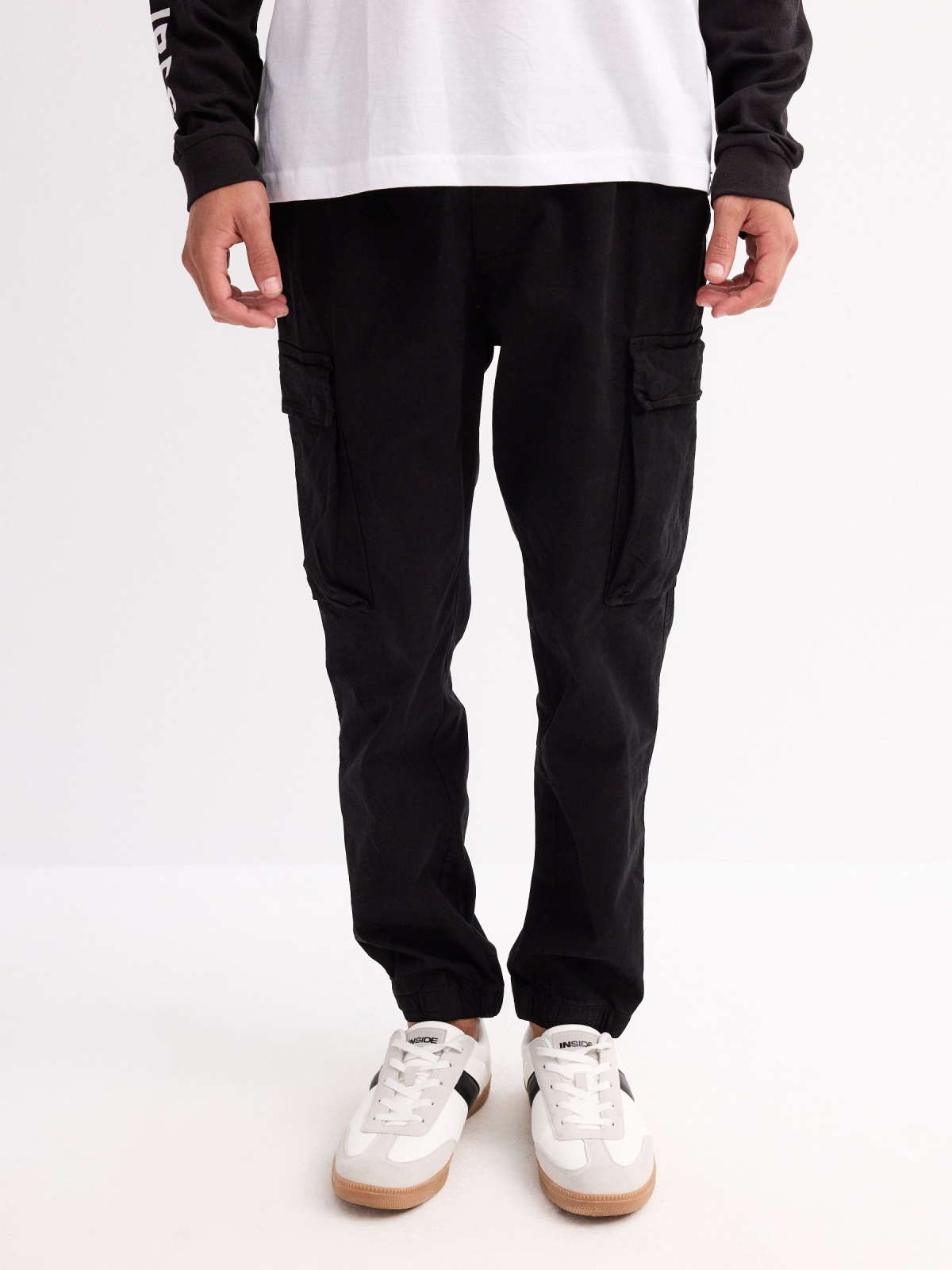 Jogger pants with leg pockets black middle front view