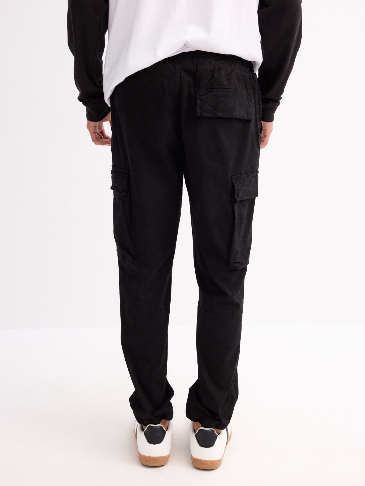 Jogger pants with leg pockets black middle back view