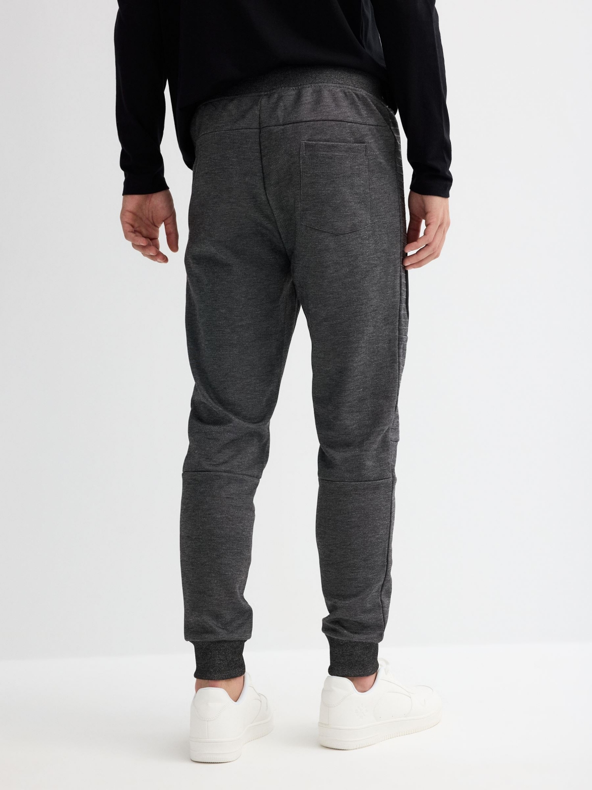 Jogger pants with zippers black middle back view