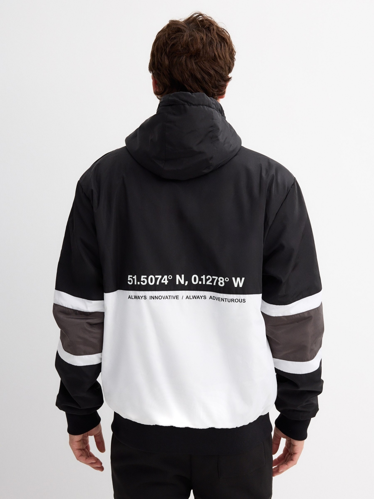 Text print padded jacket black middle back view