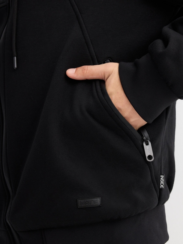 Combined hooded jacket black detail view