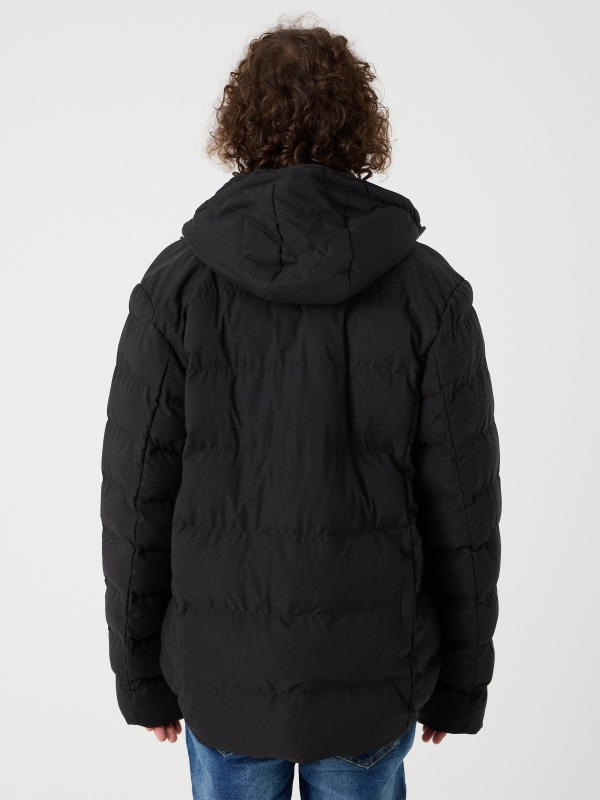 Black padded jacket black middle back view