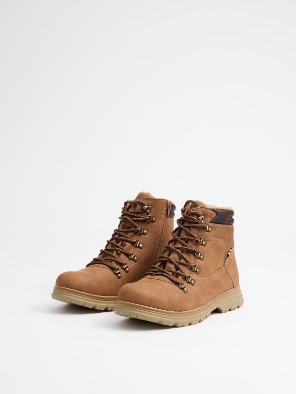 Brown sheepskin mountaineering boot beige 45º front view