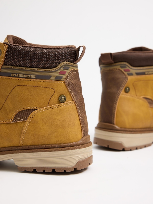 Mustard mountaineering boot with track sole yellow detail view