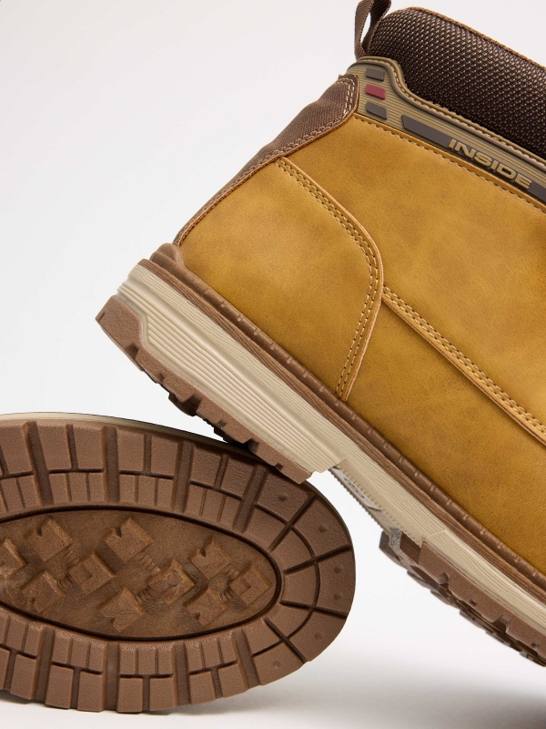 Mustard mountaineering boot with track sole yellow detail view