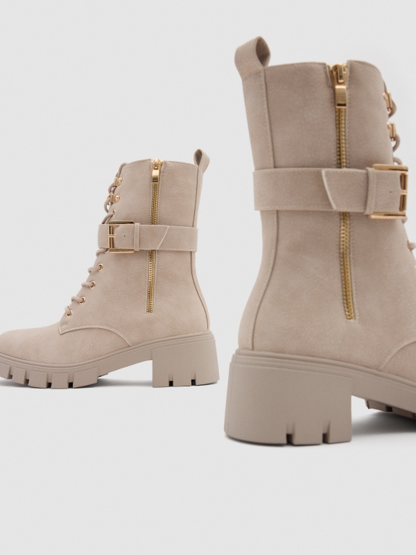 Beige lace-up ankle boot with buckle raw detail view